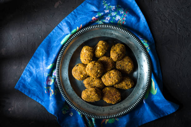 istock Vegan falafel on a tin plate on a blue napkin 865745006