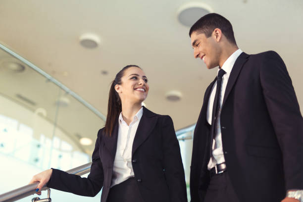istock Business colleagues talking on stairs 865746150