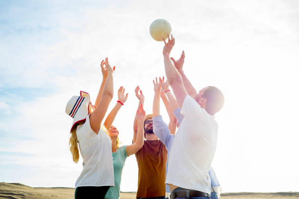 istock Friends playing volleyball 865748756