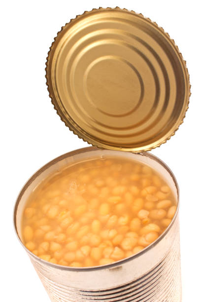 istock Open tin can of beans  on white background 865749054