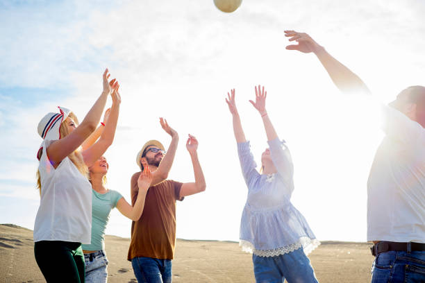 istock Friends playing volleyball 865749142