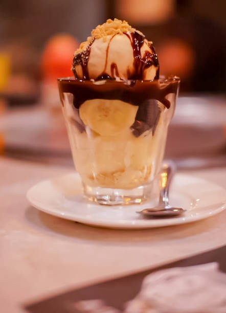istock Banana Chocolate, vanilla Ice cream in the cup with a spoon. 865752668