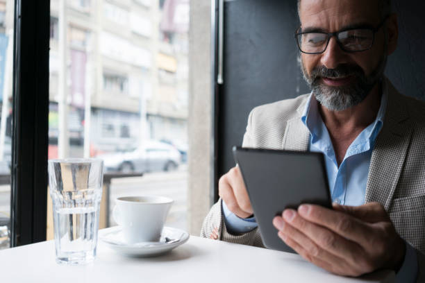 istock Dedicated Businessman Working At Cafe 865756516