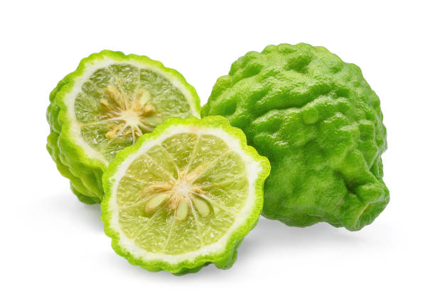 istock whole and half of green fresh bergamot isolated on white background 865760478