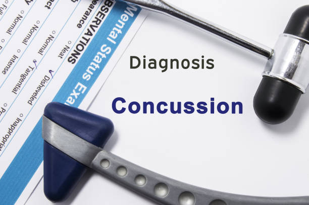Diagnosis of Concussion. Two neurological hammer, result of mental status exam and name of neurologic psychiatric diagnosis Concussion on a white background or on doctor table Diagnosis of Concussion. Two neurological hammer, result of mental status exam and name of neurologic psychiatric diagnosis Concussion on a white background or on doctor table concussion stock pictures, royalty-free photos & images