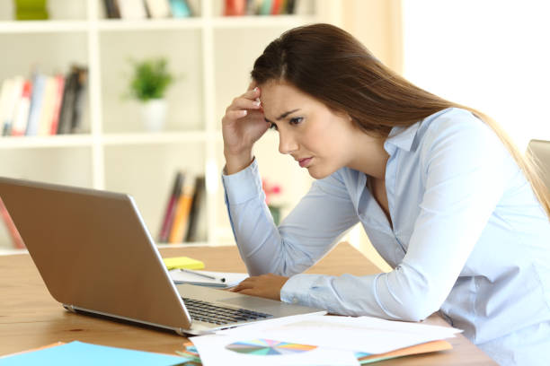 istock Worried freelance worker reading bad news on line 865765062