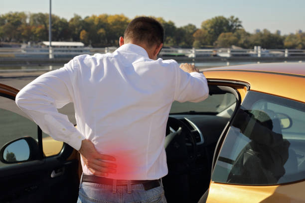 istock Man with back pain after long car drive. Incorrect sitting posture problems ,Muscle spasm, rheumatism. Pain relief, ,chiropractic concept. 865768224