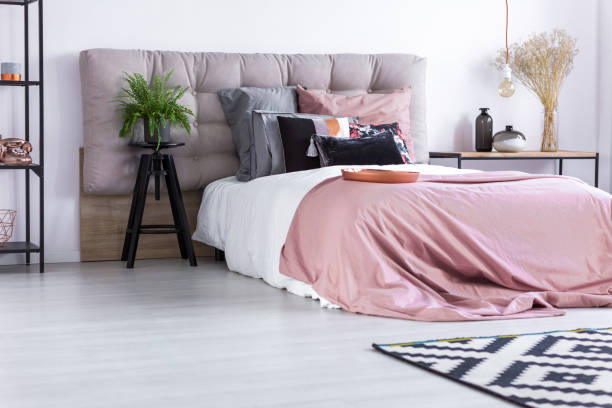 istock Bed with pink quilt cover 865771816