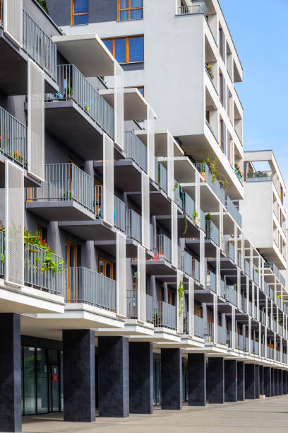 istock Modern apartment building on a sunny summer day 865772660