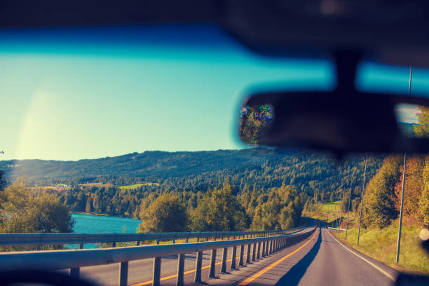 istock View from the windscreen. Driving a car on the mountain road. Nature Norway 865773048