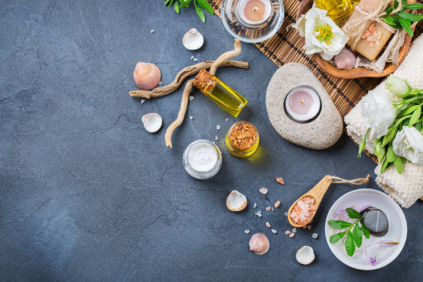 istock Spa wellness setting concept with spring flowers, black background 865773812