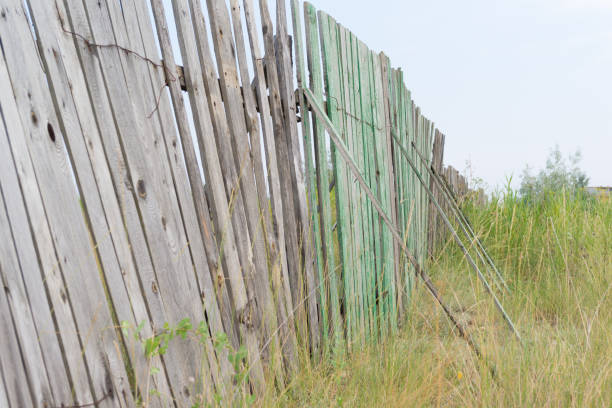 istock Rickety fence near the grass 865773838