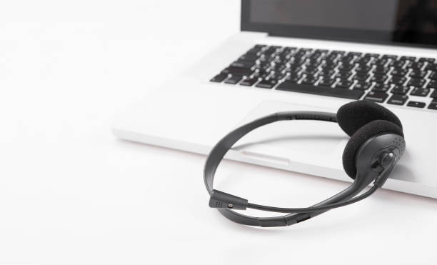 istock headset and computer laptop, call center support and customer service help, concept for communication 865777186