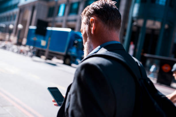 istock Businessman using smart phone in the city 865780026