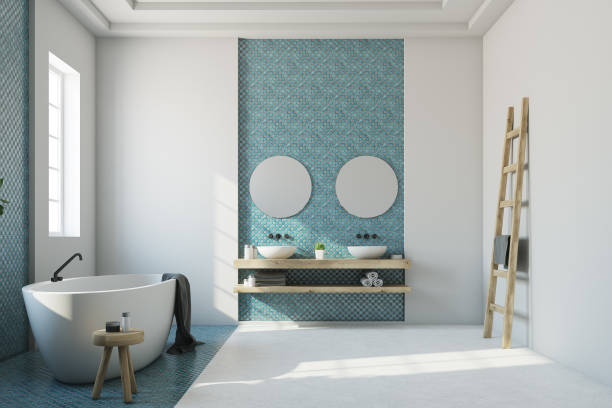 istock Blue and white bathroom, white tub, sink 865780042