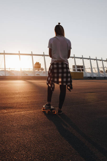 istock Hipster girl with skate board 865785896