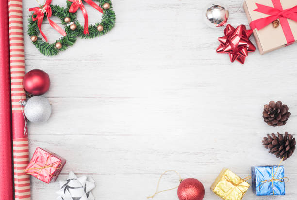 istock Christmas background with decorations and gift box copy space on wooden board. 865786070