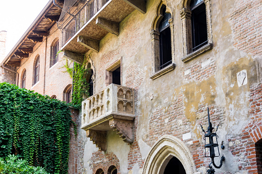 Italian building facades with laundry hanging on the walls. Copy space