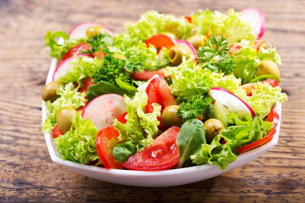istock bowl of fresh salad with vegetables and greens 865791376