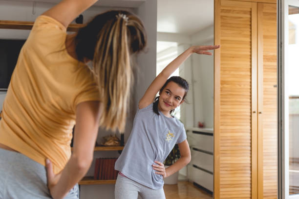 istock Mom teaches me new exercises 865800308