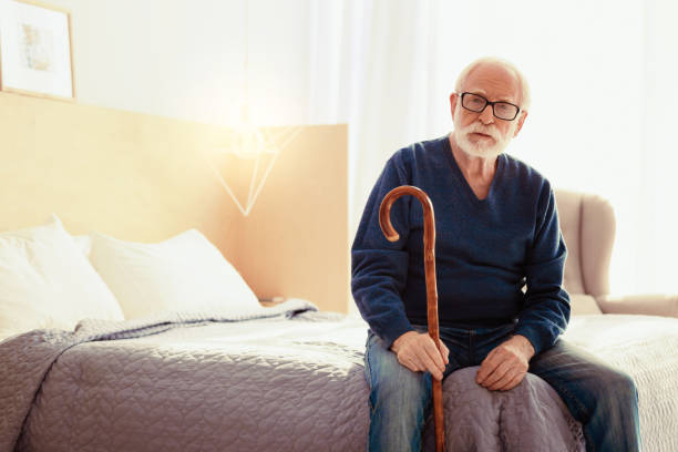 istock Thoughtful male person sitting on his bed 865800428