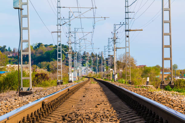 istock Railroad going into distance in sunny day 865804088