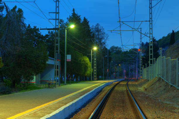 istock Platform of railway station and railroad at twilight 865804574