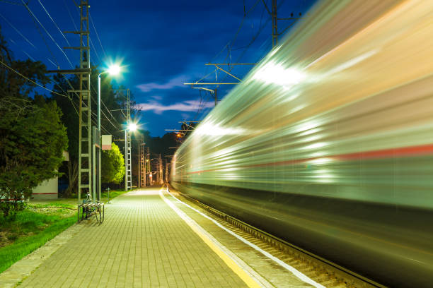 istock Platform of railway station and train in motion blur 865804586