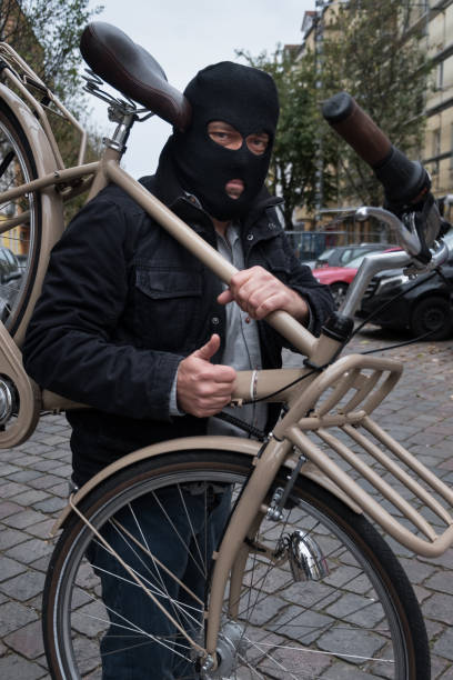 istock Theft wearing a balaclava stealing a bicycle 865804944