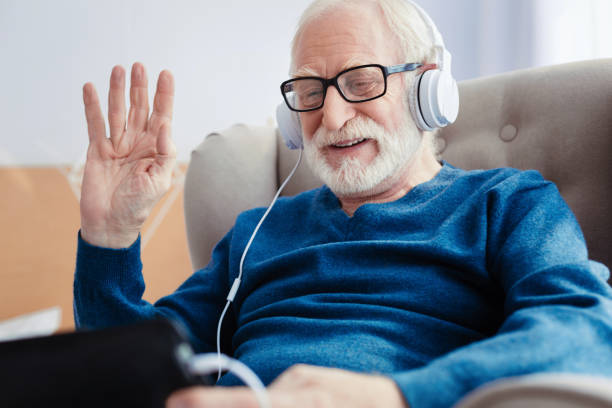 istock Portrait of delighted man that having online conversation 865807680