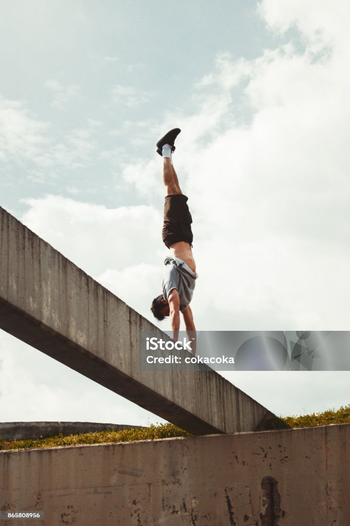 danger balance extreme sport on the strange places around the buildings Free Running Stock Photo