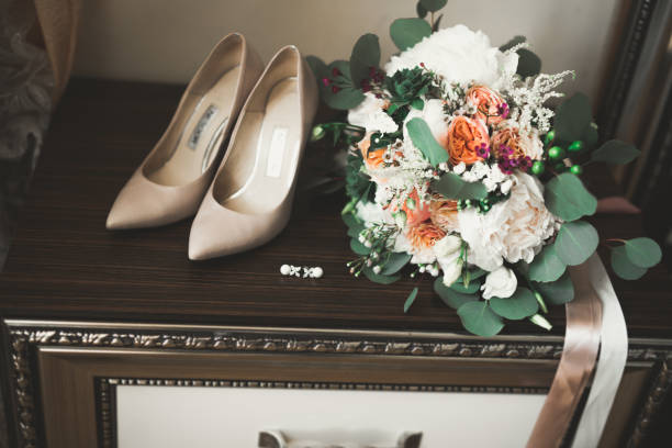 istock White stylish wedding shoes for bride. Close-up 865811896