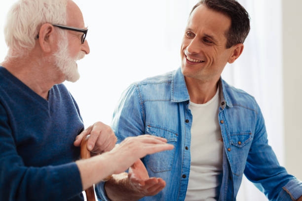 istock Delighted young man speaking with his grandpa 865812874