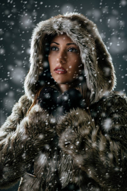 istock Girl Is Looking Through Snowflakes 865816066