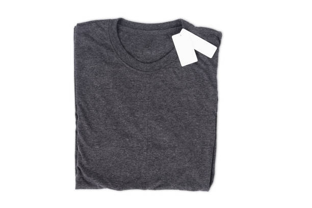istock folded t-shirt with tag isolate on white background with clipping path for design mockup 865816466