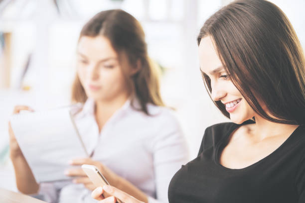istock Women with notepad and smartphone 865816508