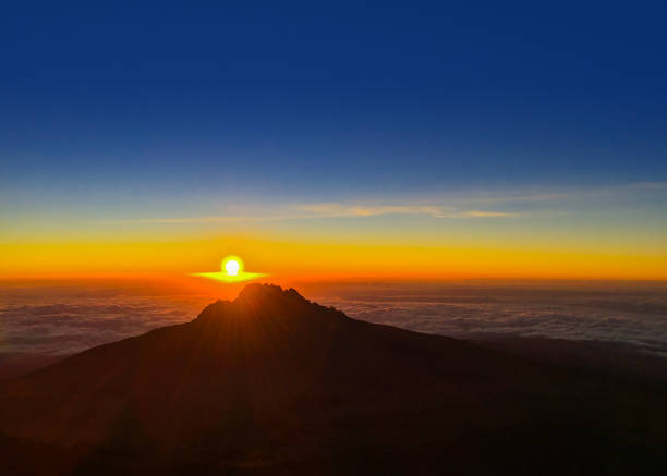 Sunrise Over Mawenzi Peak on Mt. Kilimanjaro in Tanzania, Africa Sunrise over Mawenzi Peak on a clear day on Mt. Kilimanjaro in Tanzania, Africa. mawenzi stock pictures, royalty-free photos & images