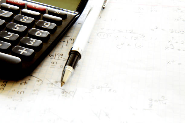 istock Calculator with pen on paper 865817974