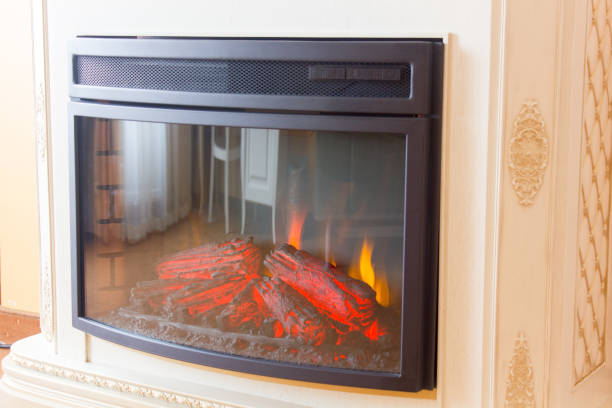 istock Electric fireplace in room 865818036