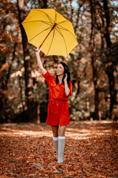 istock Happy Woman In Autumn Park 865818096