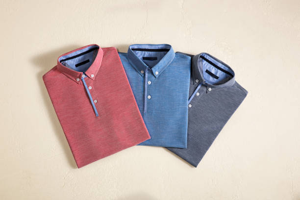 мужские рубашки изолированы на бежевом фоне - shirt polo shirt red collar стоковые фото и изображения