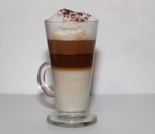 istock cappuccino in tall glass on white background 865821368