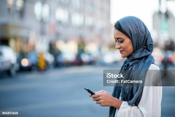 Using Technology Stock Photo - Download Image Now - Women, Indian Ethnicity, Islam