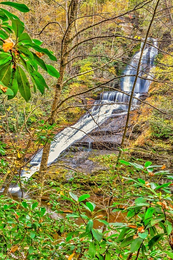 waterfalls and river during fall autumn season , vibrant colors long exposure.