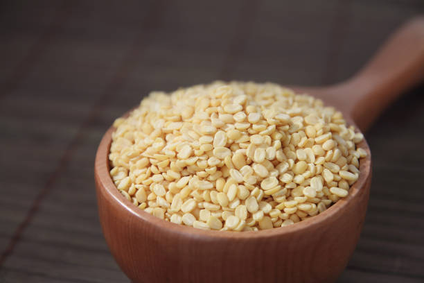 istock Husked Green Gram with Wooden Scoop 865825764