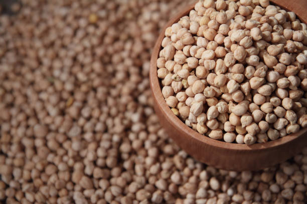 istock Chickpeas with Wooden Scoop 865825864