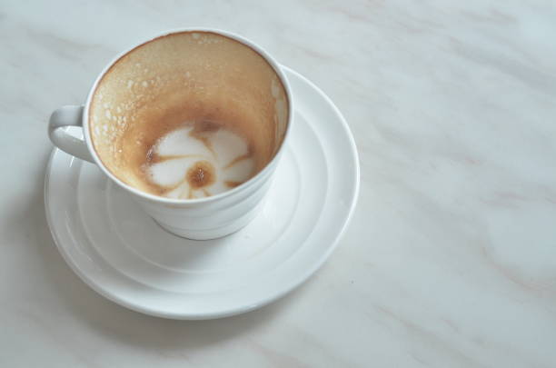 istock Cup cappuccino is Finished drink(with a flower pattern on the surface) on White marble table. 865832348