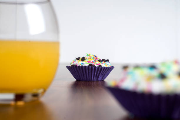 istock Tasty cupcakes on a wooden table 865832582