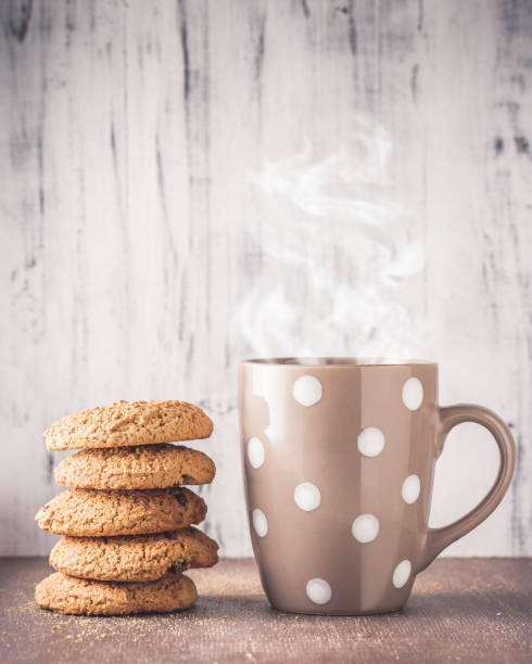 istock Stack of oat cookies over light wood 865832680