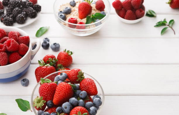 istock Mixed berries in glass bowls closeup, selective focus 865835724